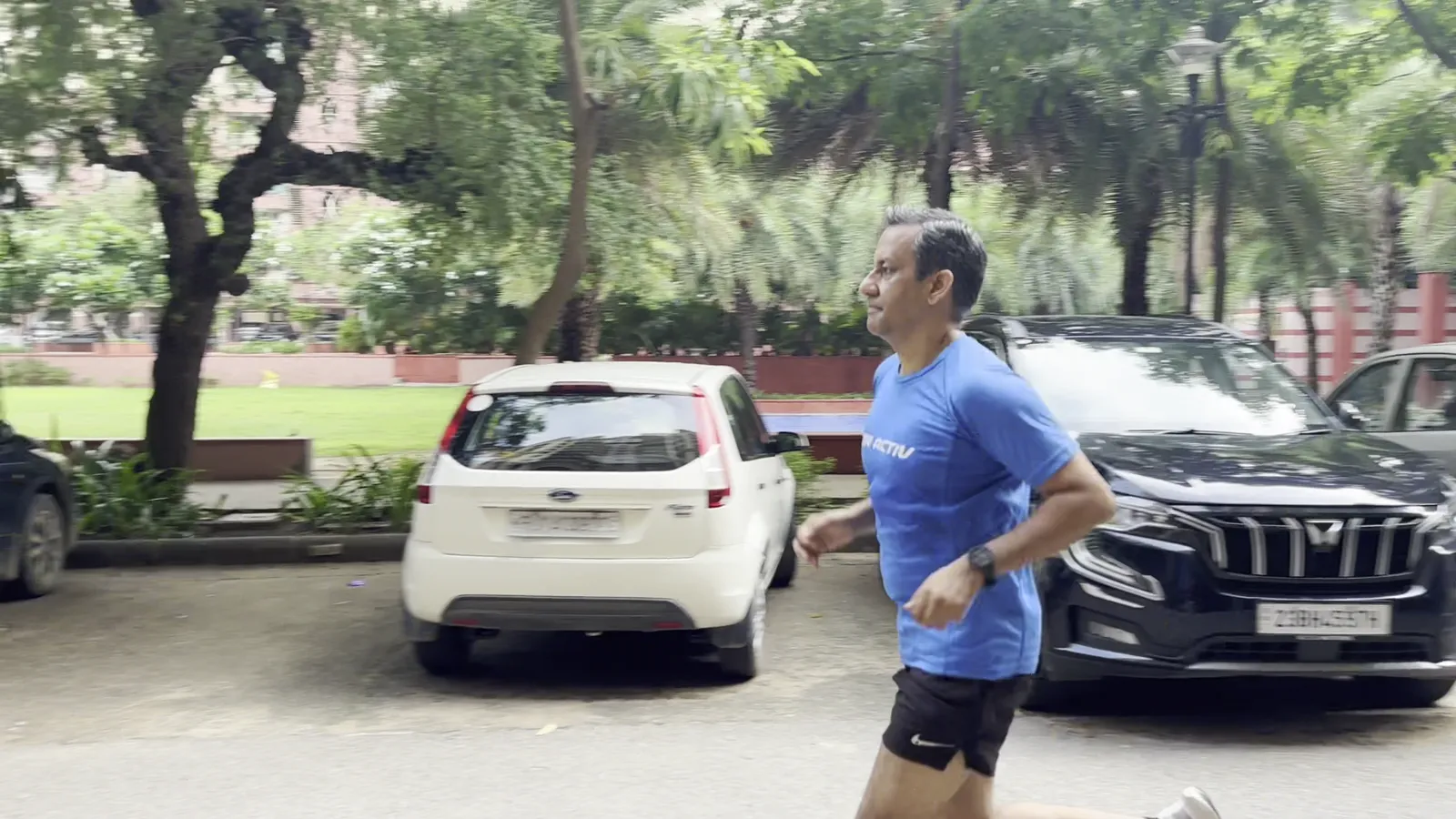 A RunActiv runner filmed mid-stride for a running technique video.