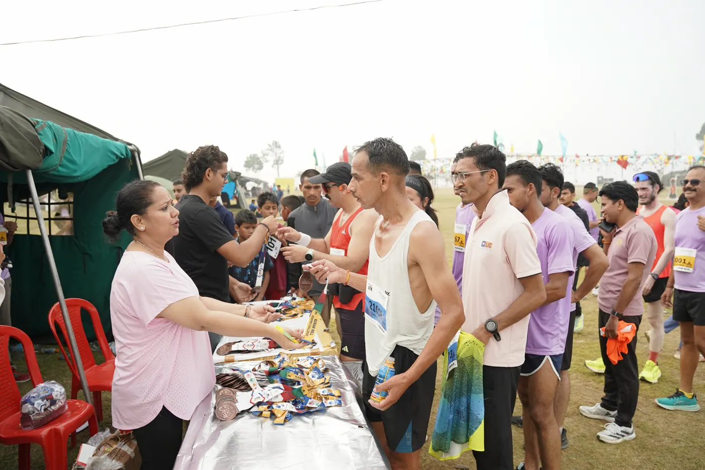 Runners collecting refreshments at the aid tent.